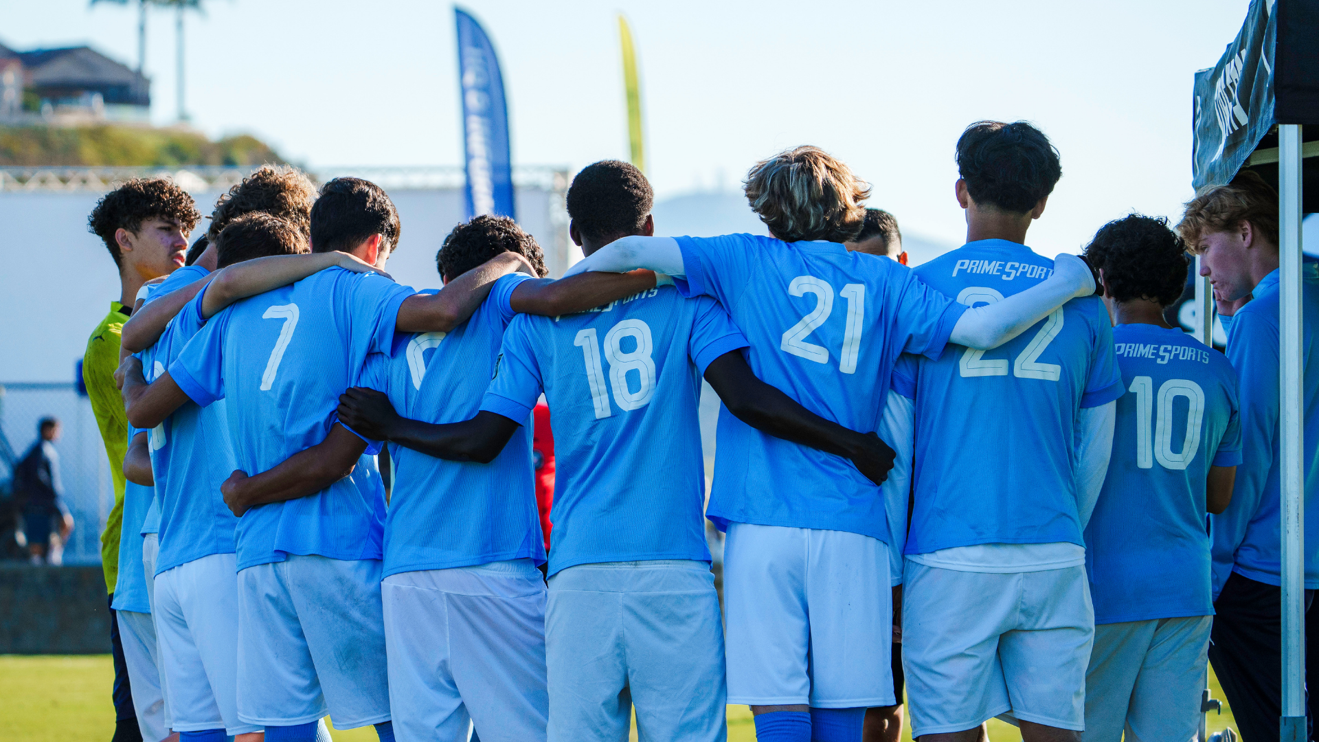 Soccer players huddling up before a game